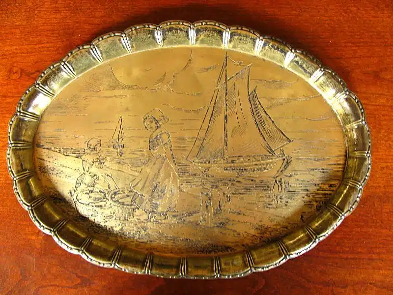 An engraved antique brass tray image